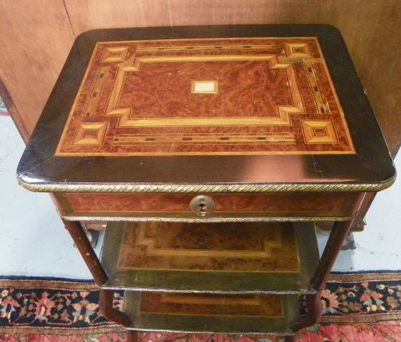 Inlaid sewing table: Missing bronze mount.