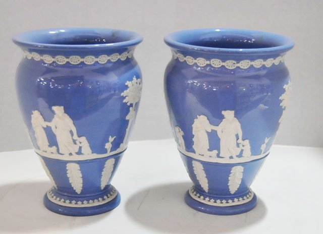 Pair blue Wedgwood Jasperware vases: Approx. 8" H x 5.75" W. From a Brooklyn, NY estate. Please read our terms of sale.