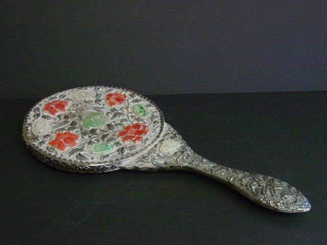 19th c. Chinese 900 silver hand mirror: With jade & carnelian relief. Slight dent. Approx. 13" x 6" Please read our terms of sale.