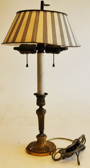 19th c. antique French bronze candle stick lamp: With Tole shade. Approx. 21" H. Please read our terms of sale.