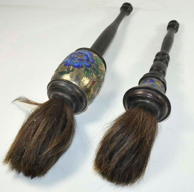 2 Chinese enamel & wood calligraphy brushes: Ca. 1920. Approx. 17" & 15". Please read our terms of sale.