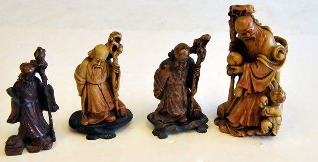 Lot of 4 soapstone figures: "Sages with Staffs". Approx. 4.25" - 5.5" H. Please read our terms of sale.
