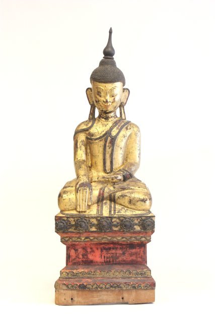 Lacquered wood patinated seated Guan Yin: Gold & red. Approx. 36" H. Please read our terms of sale.