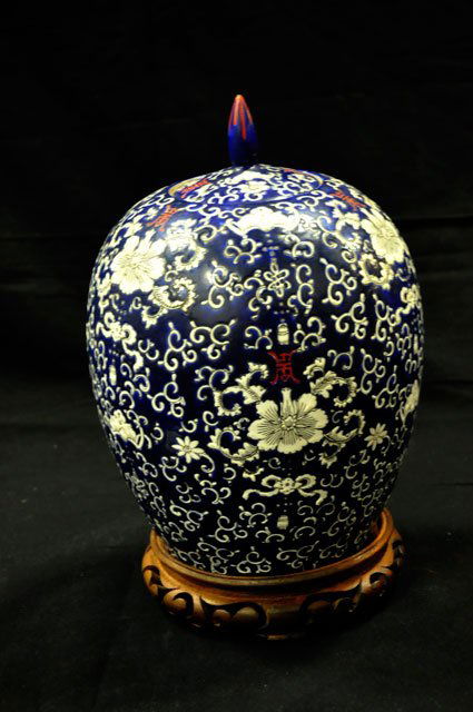 Covered ginger jar: With unusual black & white design on stand. Approx. 12" H. Please read our terms of sale.