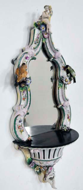 German figural porcelain mirror: Some losses. Approx. 34.5" L x 14.5".