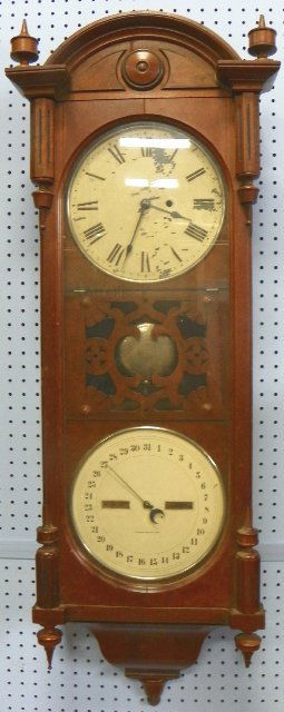 Victorian Seth Thomas mahogany wall clock: Clock & calender. Paint loss on face. Approx. 48" H
