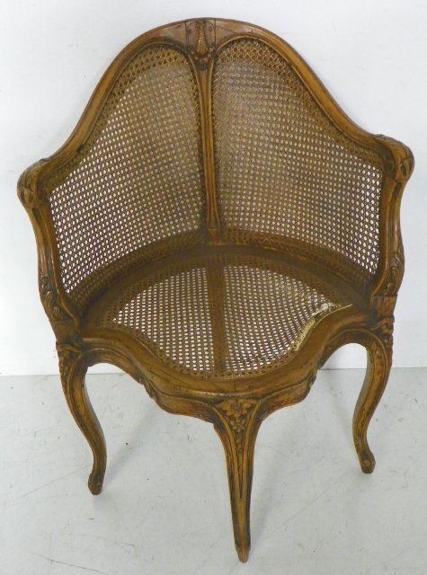Decorative French cane corner chair: Cane seat damaged. Approx. 36" H x 26" W x 19.5" D.
