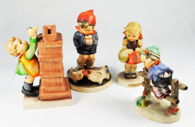 Group lot 4 Hummels: Including: 1-#66 "Boy with Two Pigs". 1-204/3/0 "Boy & Frog on Fence". 1-#116 "Children's Bank". 1-6110 "School Girl".