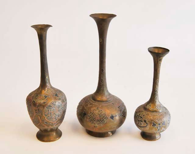 Group lot of 3 Middle Eastern vases: Brass with silver inlay. Approx. 9.75", 9" & 7.5" H.