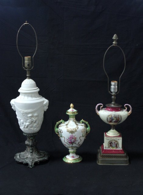 Group lot of 2 lamps and 1 urn: 1- Covered urn. 1- Baroque figural lamp, approx. 18" H. 1- Porcelain double handled urn lamp, approx. 12" H. 1- Covered 2 handled porcelain vase "Franz Art", approx. 12" H