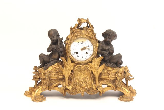 Dore patinated bronze clock: With double figure, 19th c., Paris, France, wear on face. Approx. 13" x 17".
