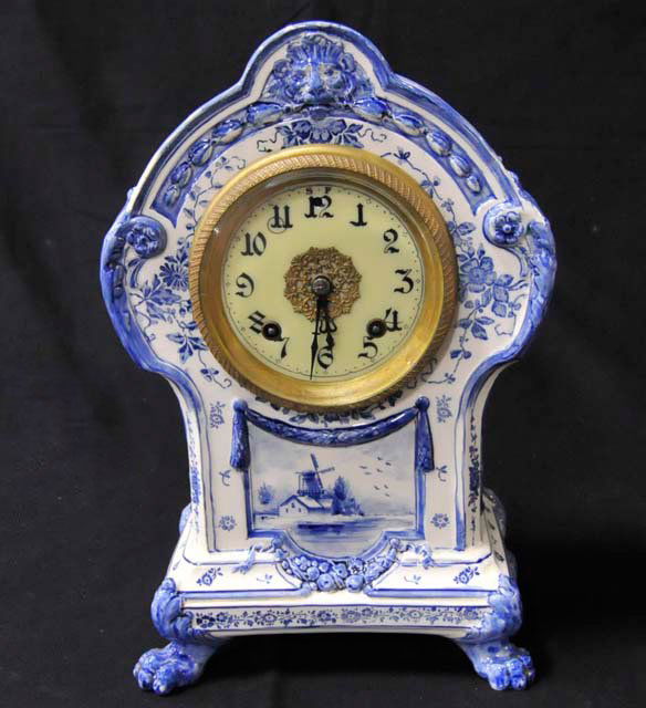 Porcelain Smyrna Delft 8 day strike clock: 19th - early 20th c. New Haven Clock. Co. Porcelain face. With pendulum & key. Approx. 12.5" x 8.25"