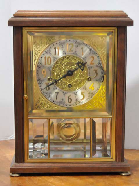 Ansonia mantle clock: Brass face & bevelled glass. With Westminster chimes Approx. 15" x 11" x 6"