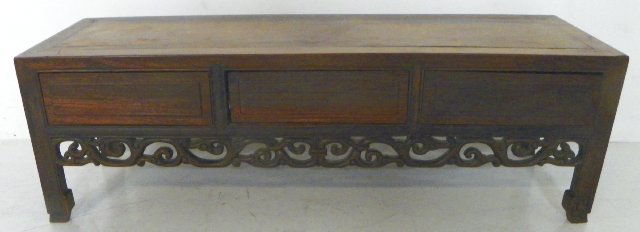 Qing Dynasty low table with 3 hidden drawers: Late Qing. Exotic wood. Approx. 37.25" W x 11.75" D x 11.75" H.