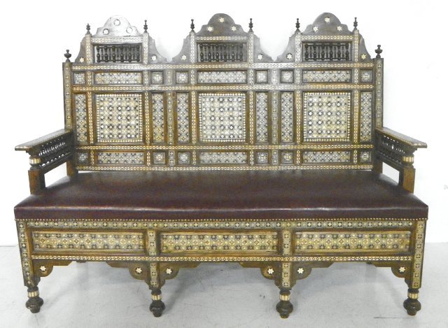 Moorish style inlaid settee: With burgundy leather upholstery. Approx. 47" H x 60" W x 20.5" D