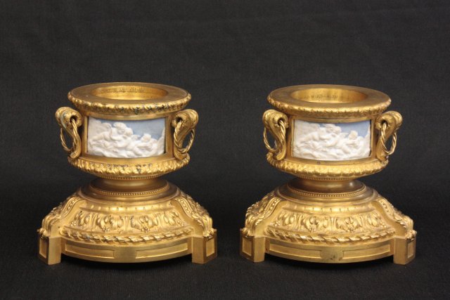 Pair dore bronze bases with porcelain plaques: 19th c., possibly Wedgwood, signed Mo Deni???, stamped Picard on bronze. Approx. 5.75" H x 4.5" Diam on top.