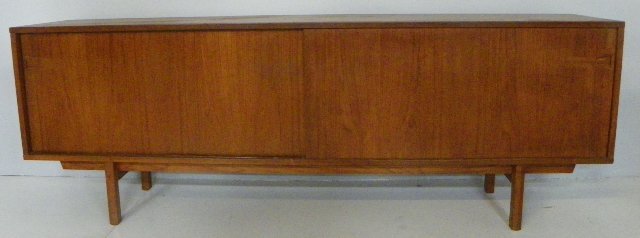 Rosewood Danish moderne cabinet: Back has been cut out for stereo & TV. Approx. 88.5" x 18.5" x 31" H. From an East End Ave, NYC estate. Please read our terms of sale.