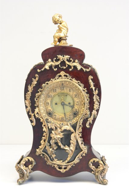 19th c. French rosewood mantle clock: Open escapement, bronze mounted, Ansonia works. Approx. 16" H. Please read our terms of sale.