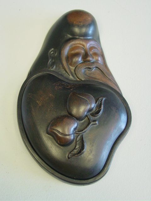 Figural inkstone depicting "Wise Man": Approx. 9" x 5.25". Please read our terms of sale.