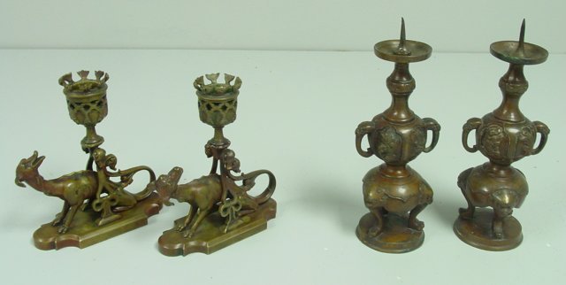 2 pair Chinese bronze candlesticks: 1- Depicting "Dogs", approx. 5.5" H. 1- "Elephant Families & Foo Dog Faces". From the estate of prominent antique collector from Brooklyn Heights, NY. Please read our terms of sale.