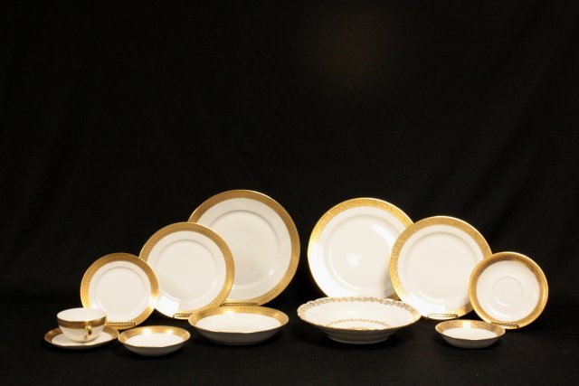 Box lot of gold rimmed dishes over 125 pieces: Including: 10- Haviland & Co. soup bowls, approx. 9.25" Diam. 11- Limoges bowls, Vignaud Limoges, approx. 5" Diam. 11- Vignaud Limoges "W" plates, approx. 6.25". 12- Selb Bavarian bowls, approx. 5" Di