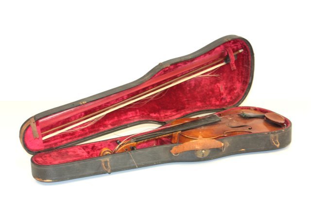 2 piece back violin: With paper label Heinrich Heberlein Jr, Made in Germany with bow stamped Germany with case. Approx. 13.5". From a Ft. Lee, NJ estate. Please read our terms of sale.