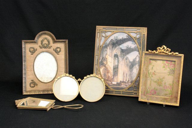 4 brass & 1 mirror: 4 brass frames & 1 mirror with folding handle. Approx. 4" x 8" - 11" x 8.25". From the estate of prominent antique collector from Brooklyn Heights, NY. Please read our terms of sale.