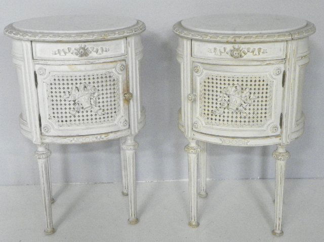 Pair 1900's oval marble top French commodes: Off white, with cane door & drawer, panelled sides, "Floral" design. From a Ft. Lee, NJ estate. Please read our terms of sale.