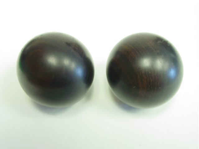 Pair Chinese Zitan balls: Approx. 1.5" Diam. Please read our terms of sale.