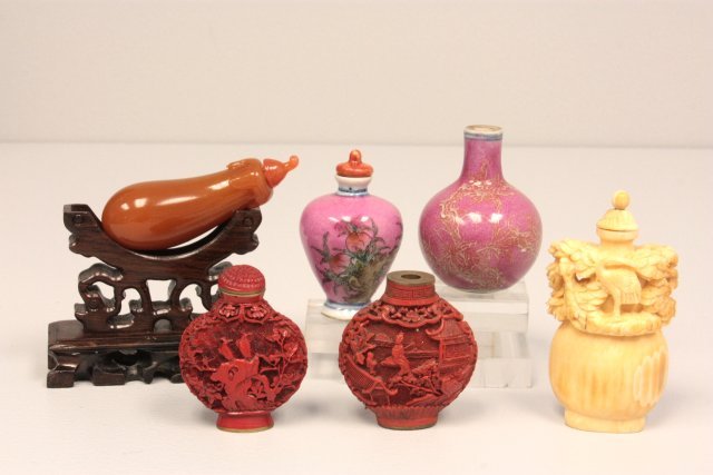 6 piece lot of Chinese articles: Including: 2 small vases, 2 cinnabar snuff boxes, bone snuff box & carved "Eggplant" on stand. Please read our terms of sale.