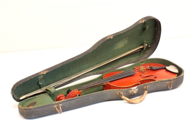 2 piece back violin with paper label: "Antonius Stradivarius Cremonensis, Made in Bohemia", bow signed Louis, good condition. Approx. 23.5". Please read our terms of sale.