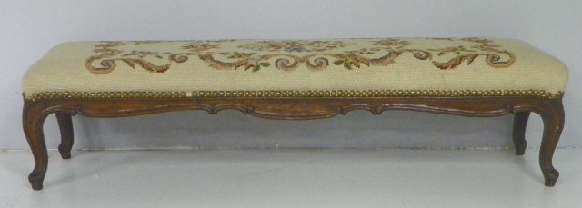 Carved walnut frame needlepoint bench: "Floral" design, ca. 19th/20th c. Approx. 40" W x 9" H x 11" D. Please read our terms of sale.