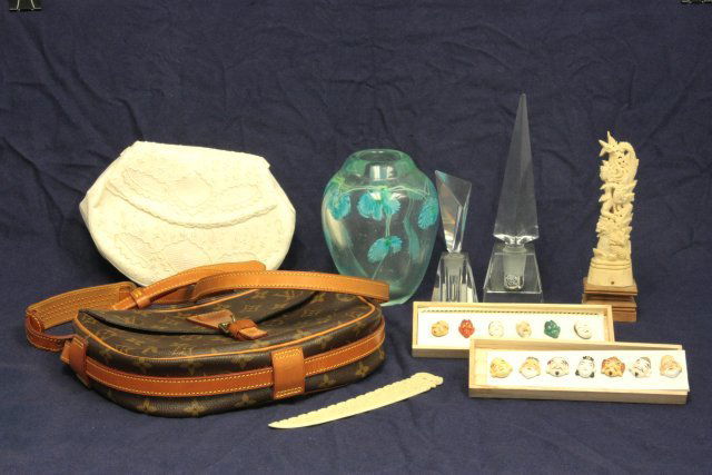 Group lot of 9 assorted smalls: Including: Louis Vuitton shoulder bag, 2 boxes Japanese porcelain mask buttons, Ladies purse, 2 crystal perfume bottles, Elephant letter holder (bone), Bone totem carving & glass vase with "Blue Flowe