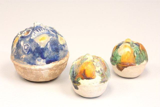 Lot of 3 Tang Sancai ceramic whistles: Earthenware with Sancai glazed decoration, "Mask" designs, 2 small, 1 large. Approx. 1.5" - 3" H. Please read our terms of sale.