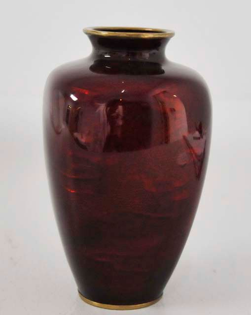 Japanese cloisonne basse taille vase signed Ando: Pigeon blood red on beautifully cut body. Approx. 6" H. Please read our terms of sale.