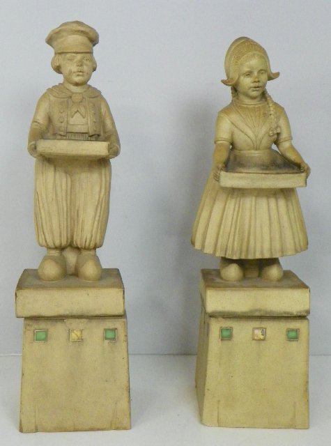 Pair Dutch terracotta statues "Boy & Girl": Signed Royal Doulton on base of statue, ca.1920's, ex Christies. Approx. 42" H x 12" W. Please read our terms of sale.