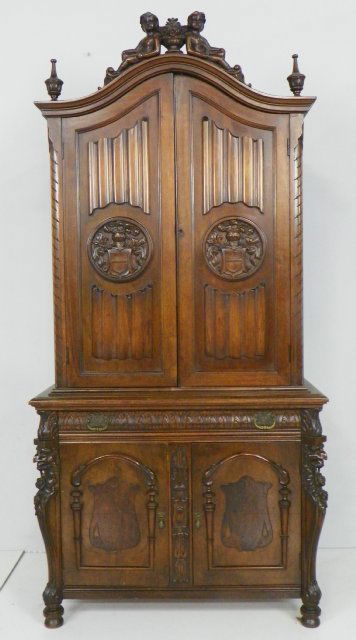 Figural walnut silver chest: With full figured & carved "Urn of Flowers" atop, carved "Griffon" on sides. Approx. 74.5" x 3' W x 18.5" D. Please read our terms of sale.