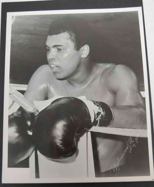 Muhammed Ali black & white photograph: Autographed, dated 1974. Approx. 8" x 10". From a Staten Island, NY estate. Please read our terms of sale.
