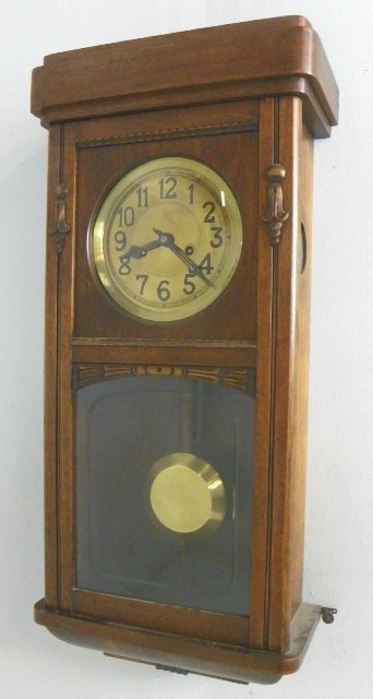 19/20th c. walnut wall regulator clock: With brass dial & pendulum. Approx. 30.25" H x 12" W x 6" D. Please read our terms of sale.