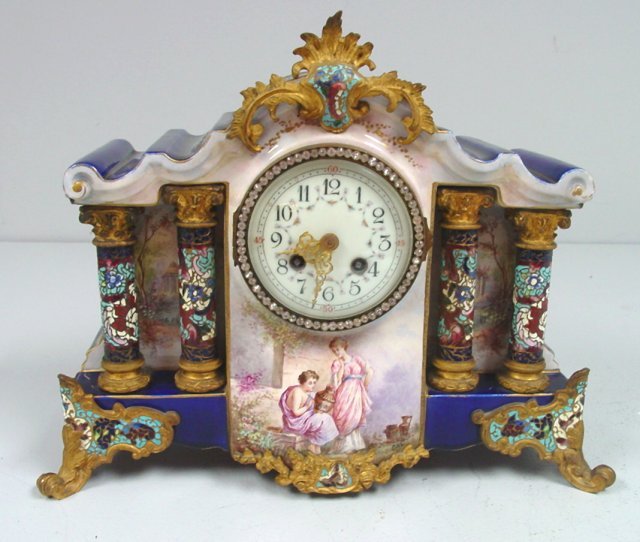 19th c. mantle clock signed Petit: French faience, bronze enameled hand painted, depicting "Artisan with Woman". Approx. 12" H x 15.5" W x 5.5" D. Minor gold wear on enamel work, in good shape. Beautiful case, no makers mark, says "Mad