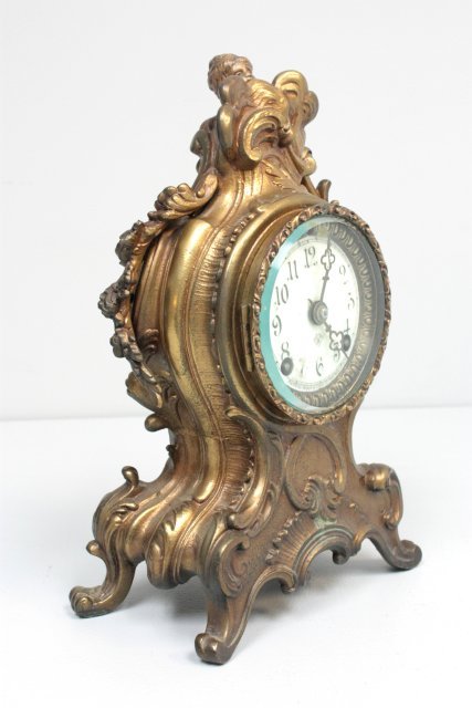 Antique Ansonia gilt metal French style clock: Approx. 11" H x 7" W. Please read our terms of sale.