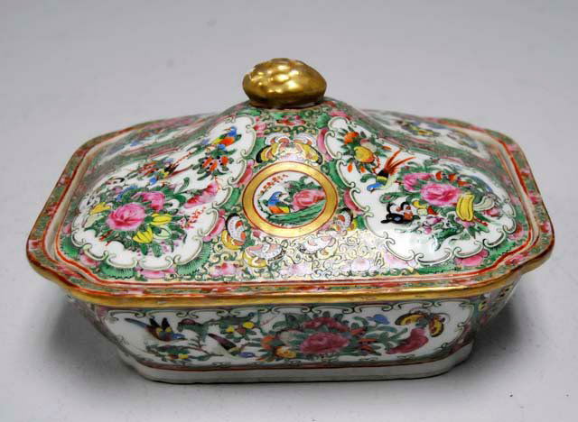 Rose Medallion covered casserole: Small chip on cover. Approx. 5" H x 9.25" L x 8" W. From the property of Catherine Land. Ms. Land was the first female Senior Producer for Grey Advertising in New York City and is a multiple Clio Awar