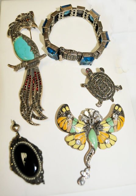 Group lot 4 pieces sterling & marcasite jewelry: Including: Turtle brooch, Peacock brooch, Butterfly brooch, marcasite & blue stone bracelet & earrings. From a Staten Island, NY estate. Please read our terms of sale.