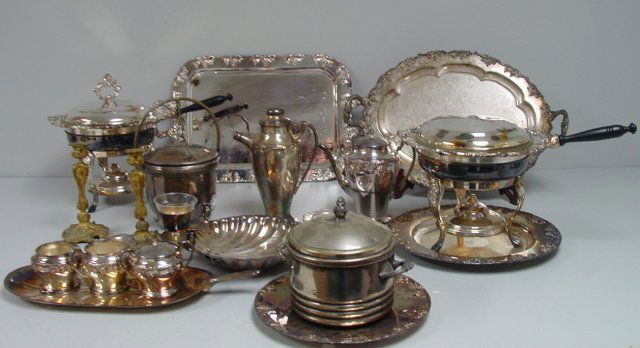 Group lot silver plate & pair bronze candlesticks: Silver plate includes: Tea set, casseroles, cocktail shaker, 2 ice buckets & trays. Please read our terms of sale.