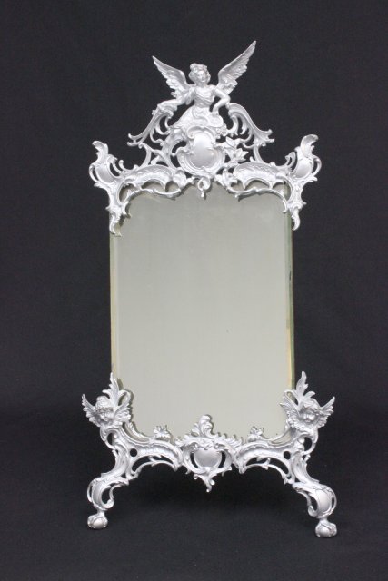 Figural Victorian easel mirror: Silver painted. Approx. 22.25" x 11.5".