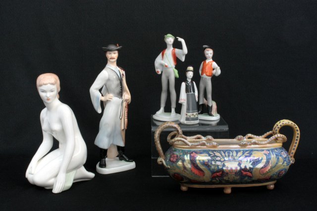 Group lot 6 pieces Hungarian porcelain: Including: 1- Unsigned Zsolnay centerpiece, as is. 2- Signed A. Quincum. 3- Signed Hollottaze. Man is approx. 10.25" H, Kneeling girl approx. 8.75" H, Boy with Goose approx. 7" H, Boy with Ax approx. 