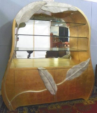 Custom made Tropicana display cabinet: Lower doors with adjustable shelves behind. Gold washed platinum leaf with matte silver finish. Approx. 82" H x 78" W x 20" D. Originally purchased from Phyllis Morris, Los Angeles, CA.