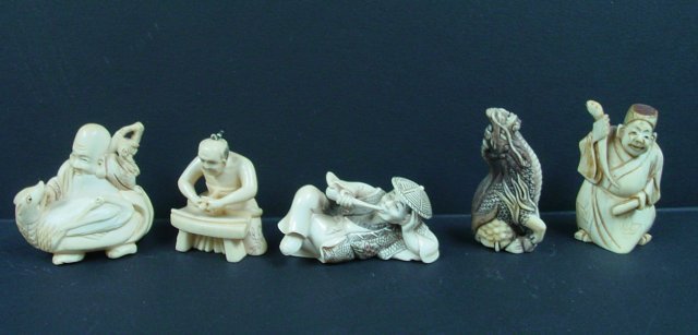 Group lot of 5 carved bone figures: 4 are artist signed. "Man Reclining Smoking a Pipe", "Man Committing Hari Kari", "Man with Snake", "Man with Animal" & "Dragon". Approx. 1" - 2" H.