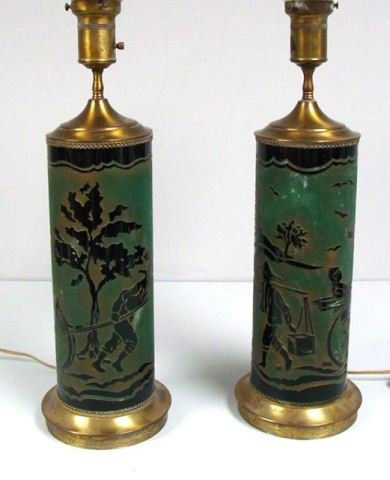 Pair acid etched cameo glass lamp bases: Possibly Steuben. With brass mounts. Approx. 22" H x 6.5" Diam. One shade has crack. From a Bronxville, NY estate. Please read our terms of sale.