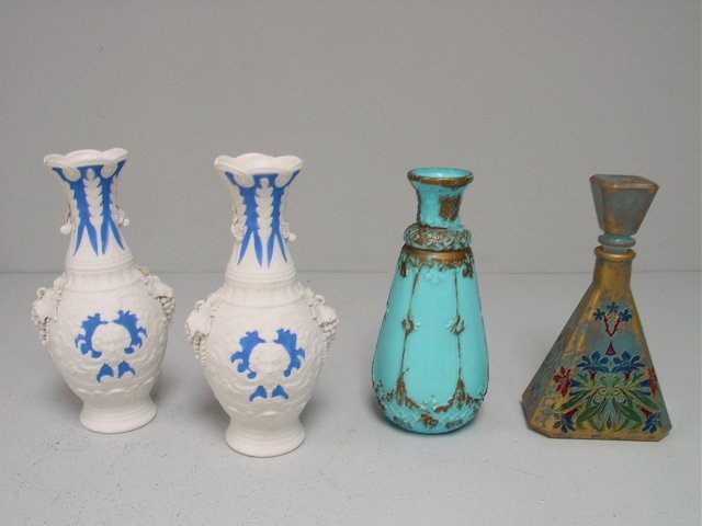 Group lot 4 vases: 1-Pair German vases (as is) 1-decorated blue perfume bottle. 1-Victorian sky blue & gold vase, 10" H. Please read our terms of sale.
